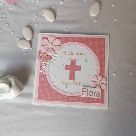 Carte de baptême rose personnalisable posée à plat
