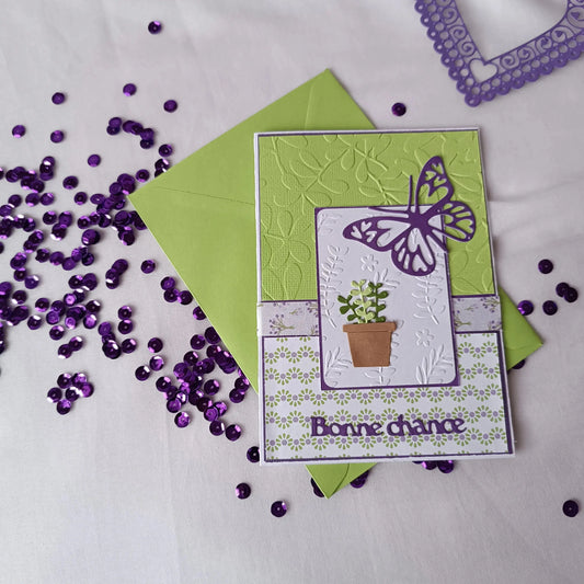 Détail du papillon et de la jeune plante sur la carte de départ