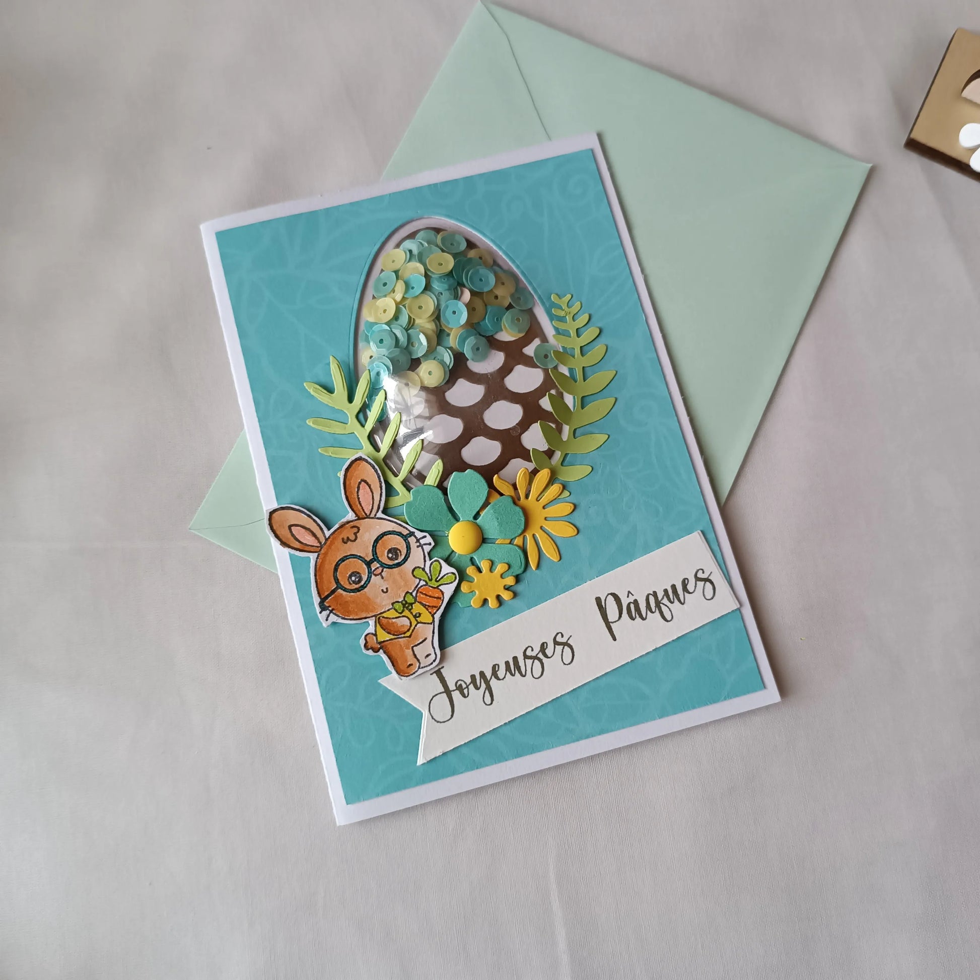 carte Joyeuses Pâques fait main de L’Atelier de Lili la souris, carte Joyeuses Pâques , carte de Pâques fait main, carte de Pâques artisanale, carte Pâques enfant, carte lapin de Pâques, carte de vœux Pâques, carte Pâques scrapbooking, carte Pâques originale, carte Pâques artisanale , carte Pâques avec lapin, carte Joyeuses Pâques fait main artisanale, carte de Pâques scrapbooking, carte de Pâques avec œuf à secouer, carte Pâques enfant fait main, carte Pâques originale enfant, carte de Pâques lapin mignon,